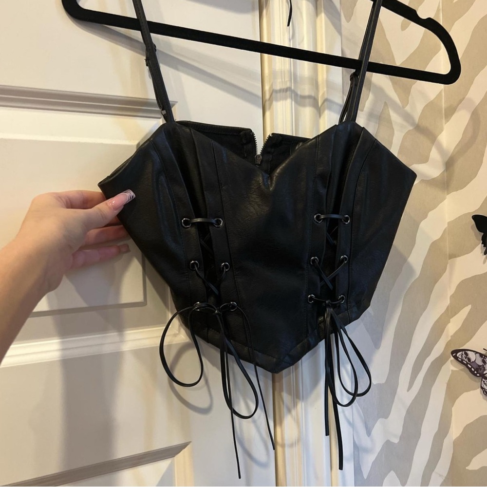 Black leather string design going out top